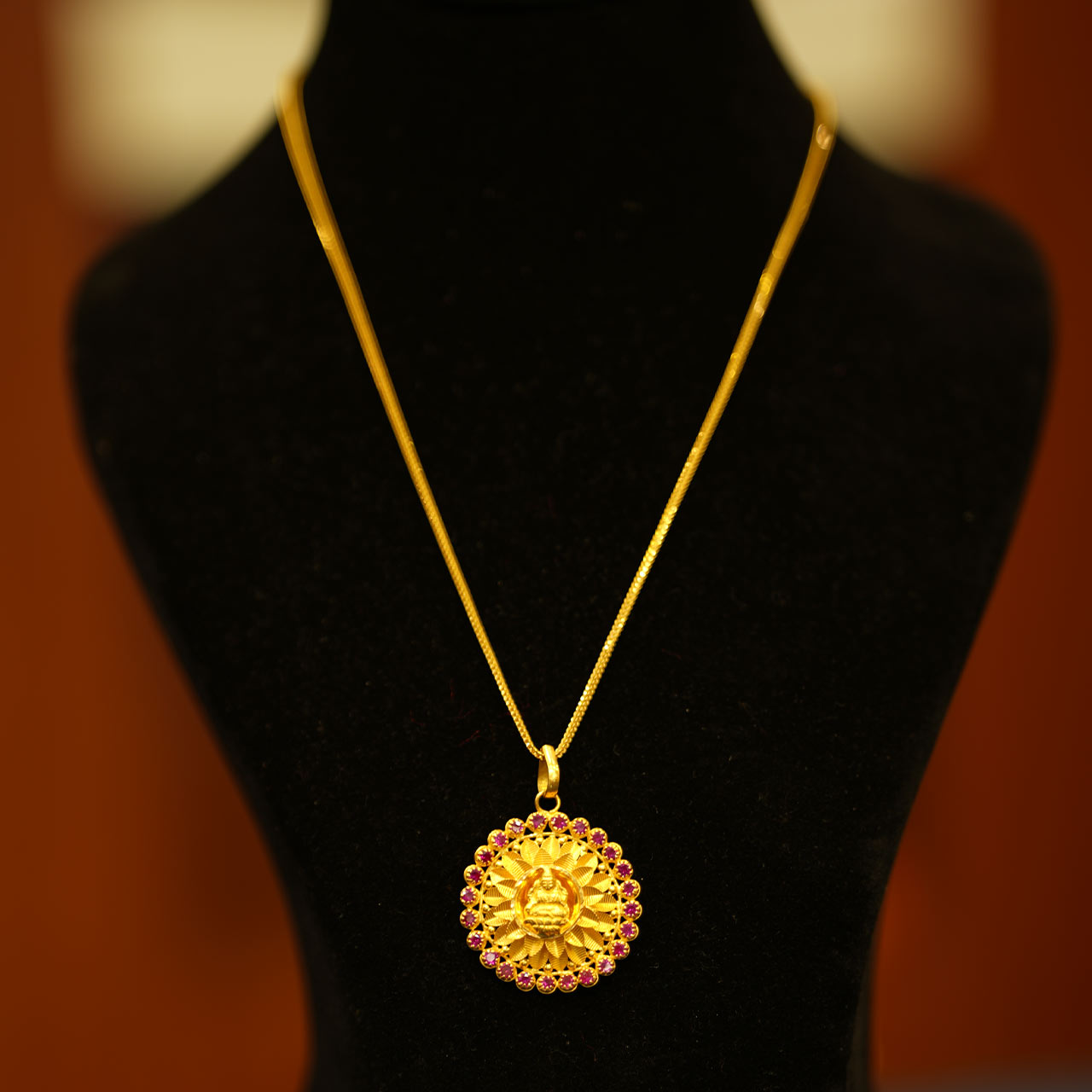 Golden neck chain with locket